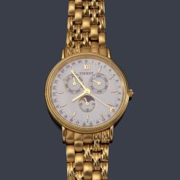 Lote 2559: TISSOT Triple Calendario y fase luna de caballero con caja y brazalete en oro amarillo de 18 K.