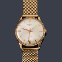 Lote 2523<br>LONGINES de caballero con caja y brazalete en oro amarillo de 18 K.