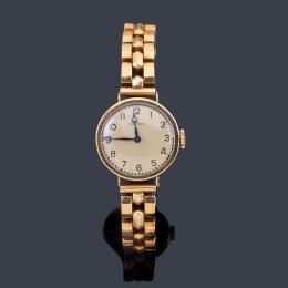 Lote 2527<br>LONGINES de señora con caja y brazalete en oro amarillo de 18 K.