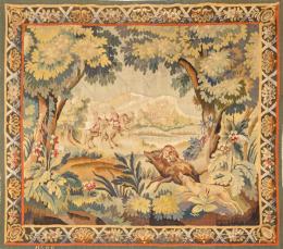 Lote 1095: Tapiz Aubusson Verdure tejido en lana y seda, en el que se representa una escena de caza enmarcado en una cenefa con cintas y motivos vegetales. Firmado H&GG. Francia, S. XVIII