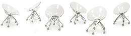 Lote 1383: Philippe Starck (1949) para Kartell. <br>Conjunto de 6 sillas Eros giratorias con ruedas, con estructura de 5 radios en acero y carcasa en polipropileno transparente.