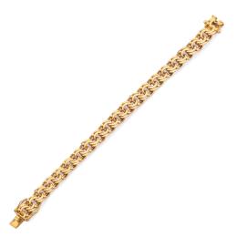 Lote 2384<br>Pulsera de eslabones barbados en montura de oro amarillo de 18K.