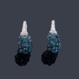 Lote 2463: Pendientes tipo criolla con remate de topacios talla briolette de aprox. 13,62 ct y brillantes de aprox. 0,49 ct en total.