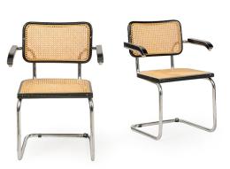 Lote 1322: Marcel Breuer (1902-1981) Reedición<br>Pareja sillas con brazos (B64) modelo Cesca. Con estructura tubular de metal cromado, asiento y respaldo de haya y paja de Viena trenzada.