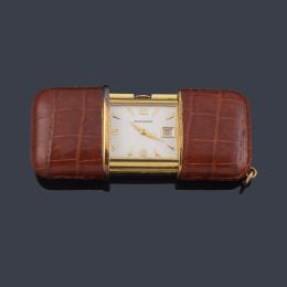 Lote 2503<br>MOVADO Ermeto nº 179  reloj de viaje con caja dorada y piel.